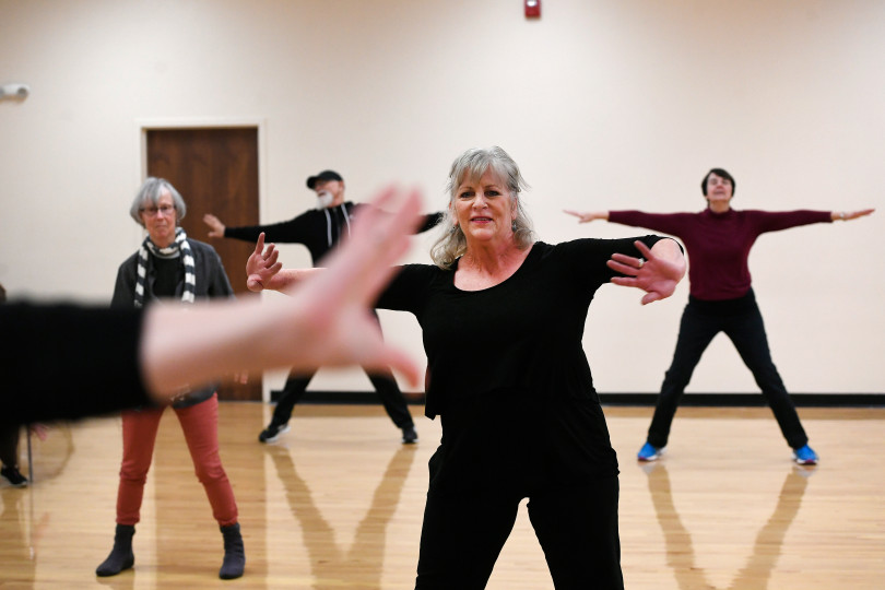 ARVADA, CO - JANUARY:  Karen Talcot, second from right, takes part in a Reconnect with your Body dance class at APEX Community Recreation Center on January 24, 2018 in Arvada, Colorado. Talcot, who has had Parkinson's for seven years takes several exercise classes a week including the Reconnect With Your Body class which is every Tuesday afternoon. This is a dance class that emphasizes a lot of rhythmic movement. The University of Colorado produced new research that says hard, physical exercise can stall the onset of Parkinson's Disease. Treadmills, fast walking, no-contact boxing and dancing are just some of the exercises people can use to stave off Parkinson's disease.  The class is taught by Sarah Leversee. (Photo by Helen H. Richardson/The Denver Post)